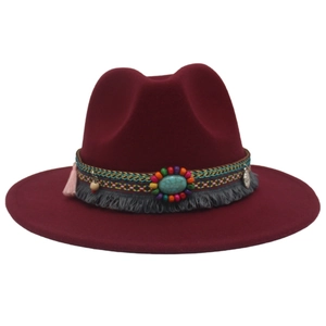 Detail of wine red felt fedora hat featuring turquoise stone and bohemian beaded band
