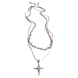 Double-layered silver star necklace with blue center stone and sparkling zircons