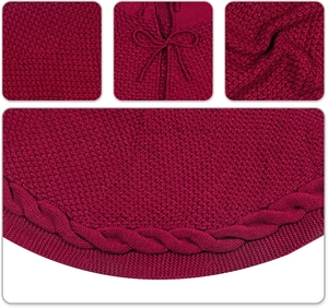 Macro view of burgundy cable knit Christmas tree skirt with drawstring closure details