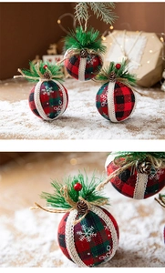 Detail of Christmas plaid foam ball with pine needles, cones, and red berries decor
