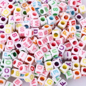 Macro shot of assorted colorful alphabet beads for creative DIY jewelry and craft making