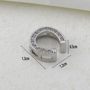 Detailed view of silver ear cuff with micro-pave zircons showing precise dimensions