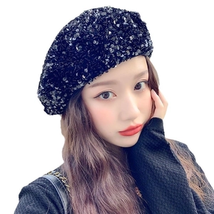 Chic black sequin beret hat for women with a shimmering finish on white background