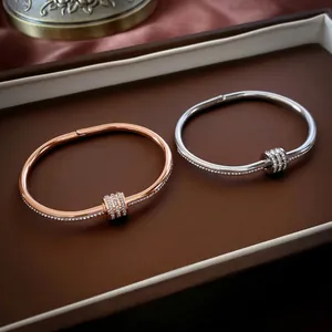 Polished titanium steel bracelets with rhinestone inlay and triple ring charm in rose gold