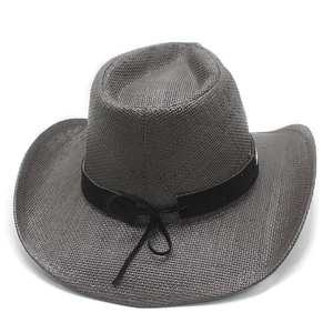 Detail of grey western straw hat with wide brim, weave texture and black decorative band