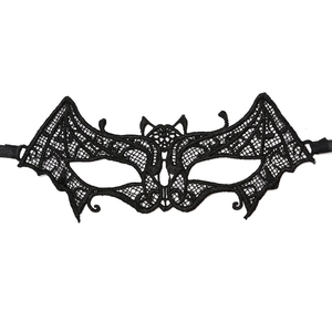 Close-up of black lace eye mask featuring a bat shape and intricate hollow patterns