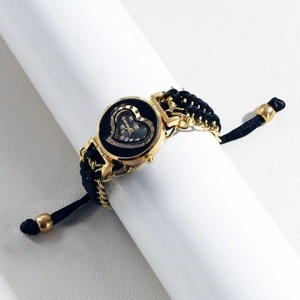 Women's gold quartz watch with black heart dial and braided rope chain bracelet
