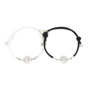 Detailed view of adjustable magnetic couple bracelets with Tree of Life charms