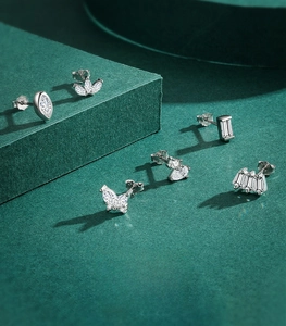 Detailed view of 925 sterling silver hallmarked stud earrings with clear zircon stones