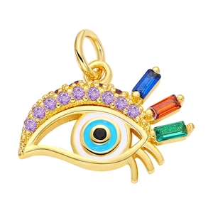 Macro view of gold evil eye pendant with colorful zirconia stones and top hanging ring