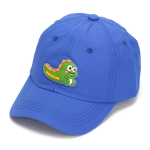 Detail of blue quick-dry dinosaur cap with a green cartoon patch and Dragon text
