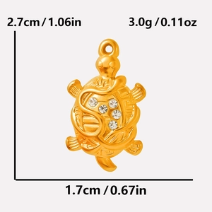 Detail view of 18k gold turtle pendant with crystal inlay and size measurements