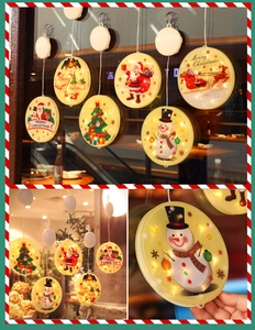 Detail of Christmas LED suction cup window light featuring festive Santa and snowman designs