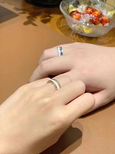 Classic rose gold and black couple rings shown in a romantic gift lifestyle setting