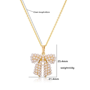 Detailed view of pearl bow necklace showing 40cm chain length and pendant size dimensions