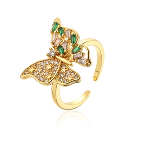 Detail of 18K gold plated butterfly ring featuring green and white zircon inlay