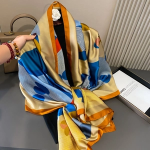 Elegant silk scarf with colorful horse print on a black mannequin, luxurious satin shawl
