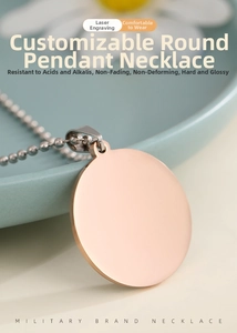 Close-up of polished rose gold round tag necklace with customized laser engraving detail