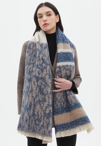 Detail of leopard print scarf with stripes and tassels in blue and beige