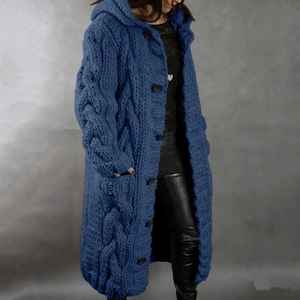Detail of navy blue chunky cable knit cardigan with hood and front buttons