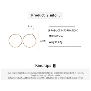Detailed view of rose gold round hoop earrings with 5cm diameter and iron material