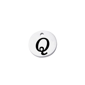 Macro view of mirror polished stainless steel round tag with black letter Q engraving