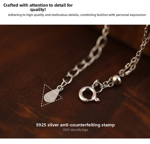 Macro shot of S925 sterling silver chain with authenticity hallmark and spring clasp