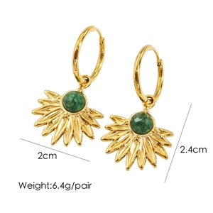 Detail view of gold maple leaf earrings with green gemstone inlay, 2cm width and 2.4cm length
