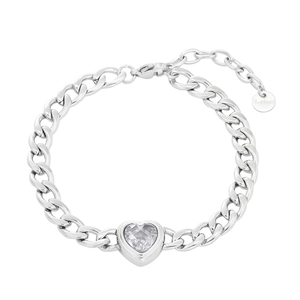 Macro shot of silver stainless steel Cuban chain bracelet with heart-shaped clear gemstone