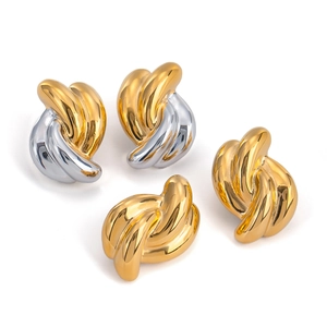 Polished stainless steel twisted hoop earrings in gold and silver finish on white background