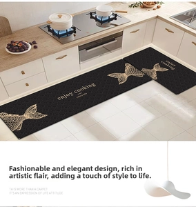Detail of non-slip kitchen mat set with golden fish scale pattern and enjoy cooking text