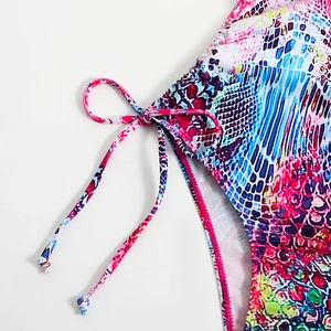 Graffiti print one-piece swimsuit with colorful snakeskin pattern and side drawstring ties