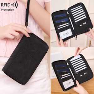 Detail view of black RFID leather passport wallet showing card slots and storage
