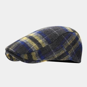 Close-up of vintage wool newsboy hat featuring blue and yellow plaid check pattern