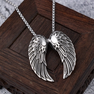 Polished stainless steel angel wings pendant necklace with vintage feather texture details