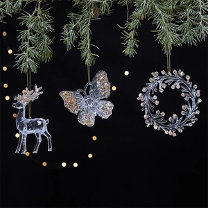 Transparent acrylic Christmas ornaments with gold sequins featuring reindeer and butterfly shapes