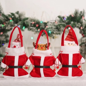 Three plush Christmas gift bags featuring snowman, elk, and Santa Claus designs on display