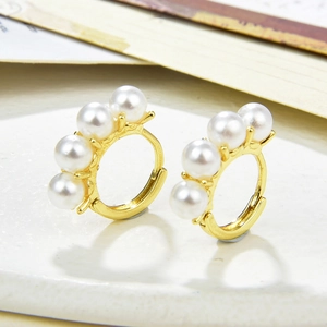 Elegant gold-plated hoop earrings featuring round white pearls for a classic jewelry look