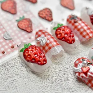 3D strawberry embossed nail art stickers with red plaid patterns and pearl accents