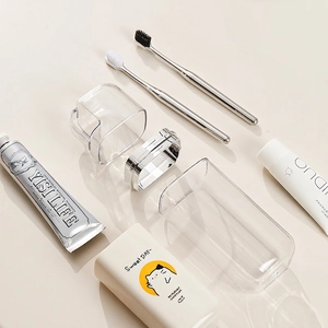 Portable travel toothbrush holder and storage cup set with a sleek metallic divider