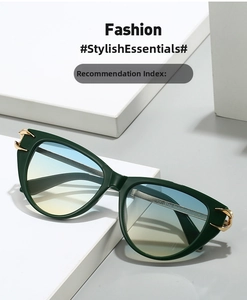 Detail of vintage cat-eye sunglasses with dark green frames and golden metal accents