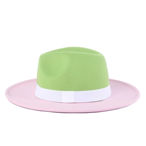 Detail of wool fedora hat with green crown, pink brim and white ribbon band