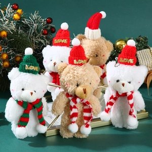 Detail of Christmas teddy bear plush pendants with LOVE knit hats and striped scarves