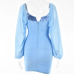 Detailed back view of light blue bodycon dress with sheer mesh sleeves and invisible zipper