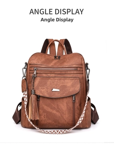 Detail view of brown PU leather backpack with vintage fringe and geometric woven strap