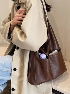Dark brown faux leather tote bag with dual front pockets and large capacity shoulder design