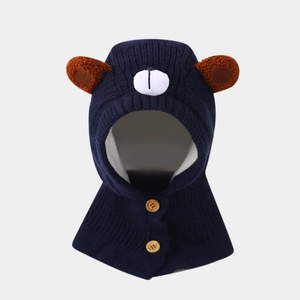 Detail of knitted baby balaclava with bear ears, wooden buttons, and cozy lining