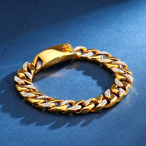 Macro view of 18K gold plated Cuban link bracelet with iced-out pave box clasp detail