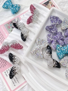 Macro shot of sparkling rhinestone bow accessories in assorted colors for DIY jewelry