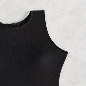Black ribbed one-piece swimsuit with high-quality texture on marble background